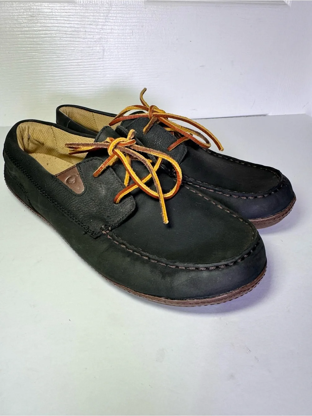 OluKai Black and Brown Leather Boat Moccasins with Tan Laces
